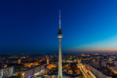 Berlin tv tower at sunset against blue sky