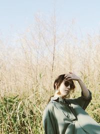 Young woman standing on field