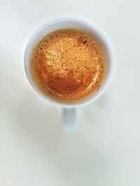 Close-up of coffee cup on white background