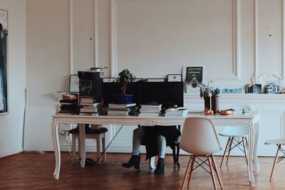 Low section of woman working at office