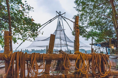 View of fishing net on land against sky