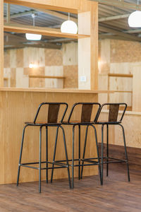 Empty chairs and table in restaurant