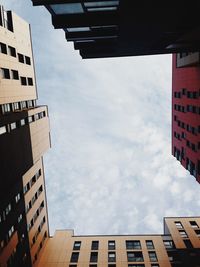 Low angle view of building against cloudy sky