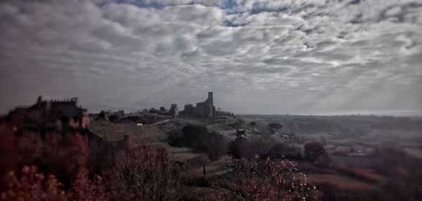 Scenic view of landscape against cloudy sky