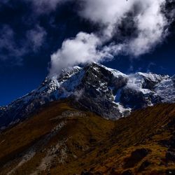 Scenic view of snowcapped mountains against sky
