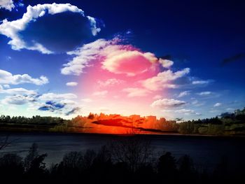 Scenic view of landscape against sky at sunset