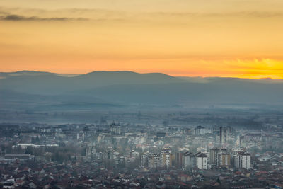 High angle view of city at sunset