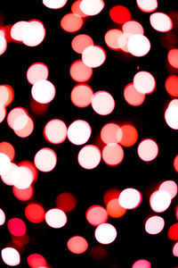 Defocused image of illuminated lights at night