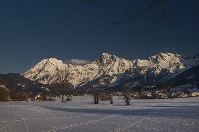 Scenic view of snowcapped mountains against sky