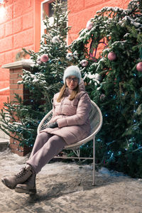 Low section of woman sitting on chair