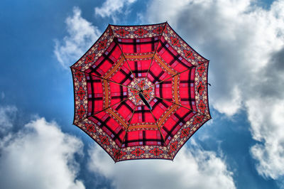 Low angle view of red house against sky