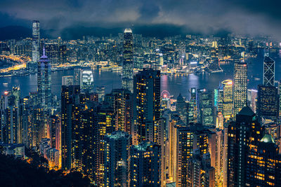 High angle view of illuminated city buildings at night