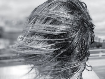 Close-up rear view of woman with short tousled hair