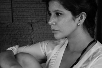 Close-up of beautiful young woman looking away