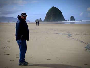 Full length of woman standing on beach