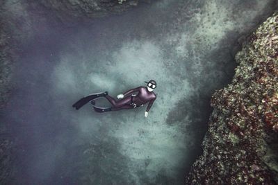 High angle view of people swimming in sea