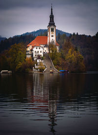 Bled lake and island with the church of st. mary of the assumption in a cloudy atumn day