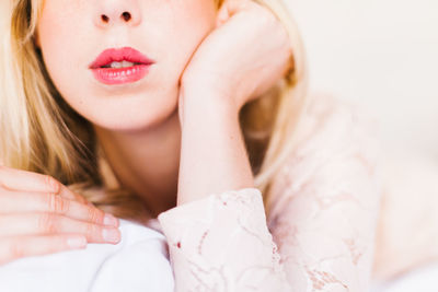 Close-up of woman with pink lipstick