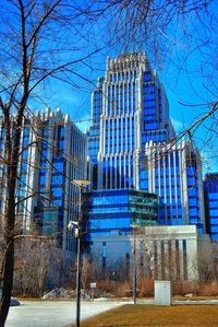 Buildings against blue sky and clouds