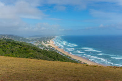 Seaside coastline with long sandy beach nature background. garden route, south africa