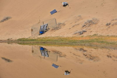 1041 reflections on lake badain east- badain jaran section of the gobi desert. inner mongolia-china.
