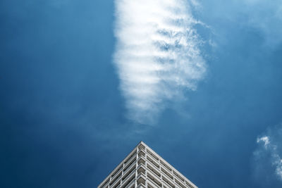 Low angle view of modern building against blue sky