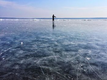 Boy skating on ice rink