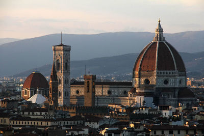 View of cathedral and cityscape against sky