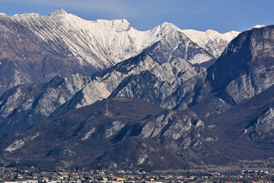 Scenic view of snowcapped mountains against sky