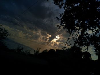 Low angle view of silhouette trees against sky during sunset