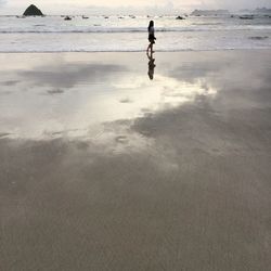 Man walking on beach