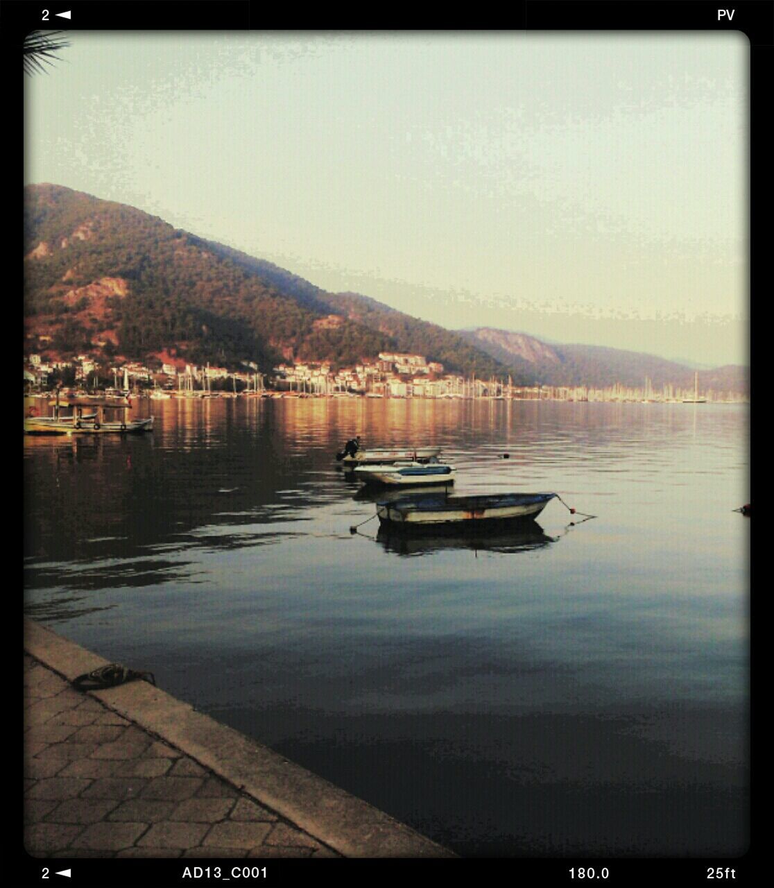 BOATS MOORED ON LAKE