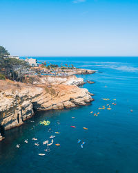 High angle view of sea against blue sky