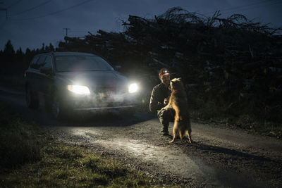 Man with dog at dusk