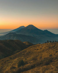 Scenic view of mountains against sky during sunset