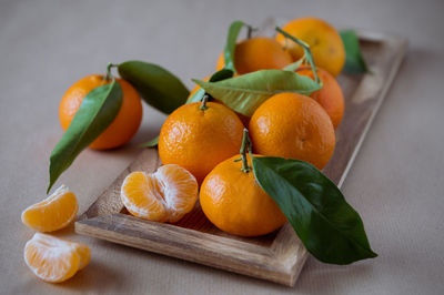 Close-up of orange fruits on cutting board