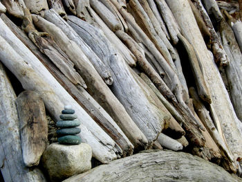 Stack of stones on driftwood