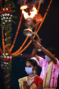 Rear view of people looking at camera