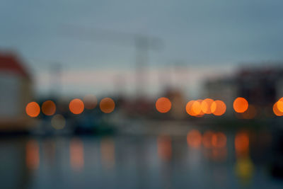 Defocused image of illuminated city at dusk