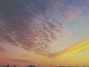 Low angle view of cloudy sky at sunset