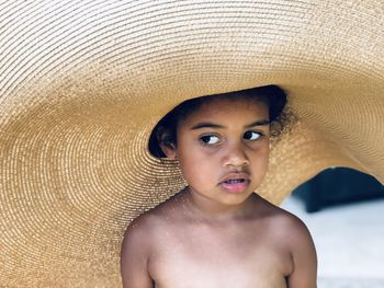 Portrait of cute girl wearing big hat