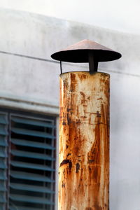 Close-up of rusty metal against wall