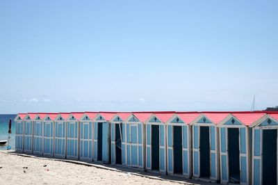 View of beach against clear blue sky