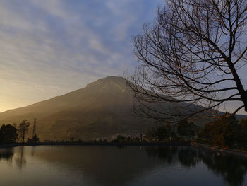 Scenic view of lake against sky during sunset