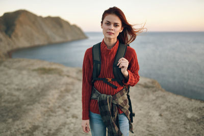 Portrait of woman standing on beach