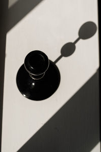 High angle view of black coffee on wall