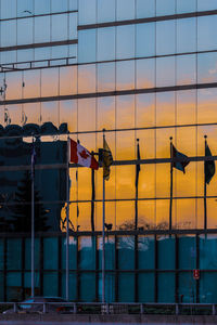 Low angle view of buildings against sky during sunset