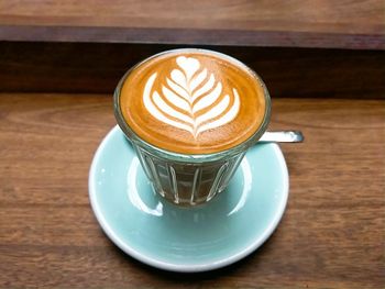 High angle view of coffee cup on table