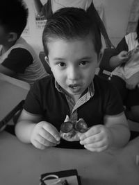 Portrait of cute boy eating food