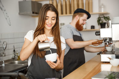 Portrait of young woman working in cafe